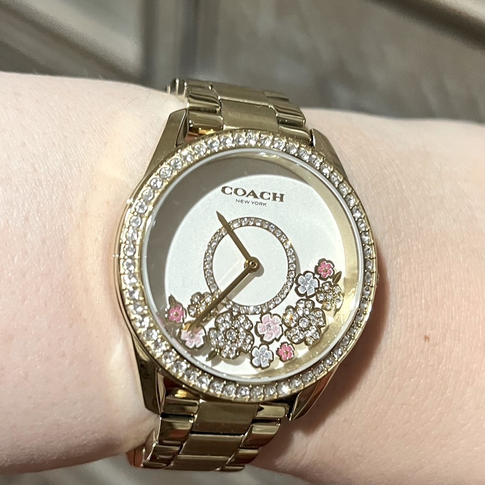 Coach only worn once Watch with spinning flowers
